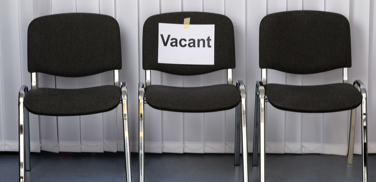 by Andrey_Popov shutterstock ID 248796937 Office Chair With A Vacant Sign At Work Place